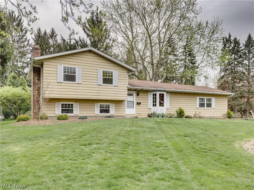 Don't miss the opportunity on this split level located on a beautifully landscaped corner lot in Tallmadge. Check out the large living room with a bay window overlooking the front yard and updated fully-applianced kitchen. Brand new carpet (2017) in the bedrooms and a recently updated bathroom on the second floor. Relax by the wood-burning fireplace in the lower-level family room or go outside and enjoy the covered patio. The second full bathroom is located on the lower level by the family room. The outside hose lines are connected to the well and the rest of the home is connected to the city water supply. Extra large shed to store your outdoor tools is located in the fenced-in back yard. New water heater in 2014. Seller is also including a 1 year home warranty. Don't miss out on this home and schedule your showing today!