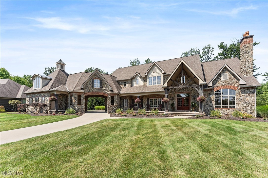Welcome to this luxurious Colonial masterpiece, where every detail has been meticulously crafted to offer both elegance and comfort. This stunning 6-bedroom, 6.5-bathroom home, set on over 1.3 acres, is designed to captivate even the most discerning buyers with its exceptional curb appeal and high-end features.The exterior of the home showcases a beautiful Fieldstone façade, blending classic charm with eye-catching appeal. A large front porch welcomes you into a grand 2-story entryway, featuring a gracefully curved stairwell. The open floor plan seamlessly connects to the expansive living room, which includes a sophisticated wood-burning fireplace and a stylish coffee-bar area. The chef’s kitchen is a culinary dream, equipped with premium Sub-Zero and Wolf appliances, a walk-in pantry, and an eat-in breakfast bar with sitting area. Enjoy your morning coffee by the additional fireplace, creating a warm and inviting space perfect for fall and winter mornings.The first floor also offers a convenient laundry room and a mudroom with ample storage. Two primary bedrooms—one on the first floor and one on the second—feature elegant tray ceilings and abundant natural light. Additionally, there are four spacious bedrooms, with two of them boasting private en-suite baths.Upstairs, a luxurious coffee room enhances the living experience and leads to an additional bedroom or office with its own separate entryway.Step outside to discover a fenced-in pool and entertaining area, complete with another fireplace for year-round gatherings. The gas-heated pool includes equipment to ensure comfort and convenience..... experience the perfect blend of luxury and functionality in this exceptional residence which is not just a home; it’s a lifestyle.