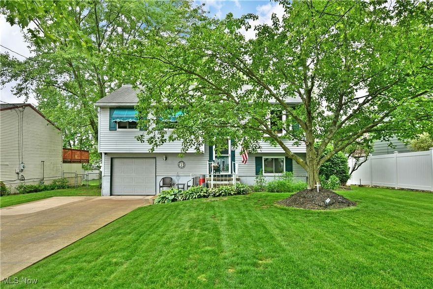 This beautifully maintained 4-bedroom bi-level home in the Girard City School District is ready for its new owner! Offering both comfort and functionality , this spacious residence is ideal for  those looking for move-in ready convenience and stylish features.  The updated large kitchen features white cabinetry, dark countertop's, a large pantry, and a full suite of stainless steel appliances- including refrigerator,stove,dishwasher, microwave with moveable wood cart/island. A charming built-in coffee bar completes the space.  Enjoy plush, well kept carpet and generous nautural light throughout. The hallway bath features a tub/shower combo and linen closet.  Further down the hall are four generously sized bedrooms each with ample closet space . Updated windows throughout the home with a transferable warranty.  The lower level will have you cozied up to the stunning wood burning fireplace in the carpeted family room.  It features a convenient walk-out access sliding glass door to the concrete covered patio to enjoy the the wood patio swing with a fenced in yard for your privacy. Spacious laundry room features a washer and dryer that stays with new hot water heater.  Attached 2 car deep garage has plenty of room for your toys, and an updated electric box.  All located in a desirable, established neighborhood with easy access to schools, shopping, and local amenities.