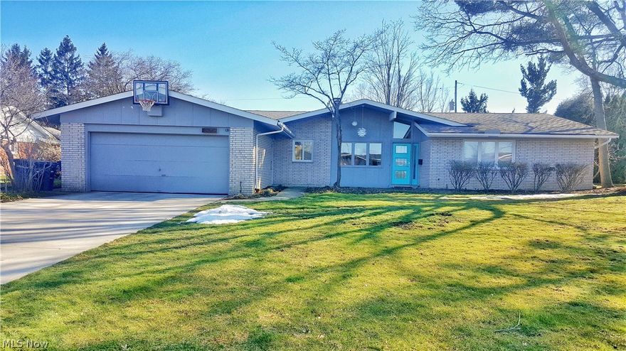Step in to this gorgeous Beachwood ranch, and you'll be reminded just why you love mid-century modern!  This home has been renovated, yet stays true to it's original roots.  Bamboo flooring in living room/dining room/family room.  Hardwood floors in bedrooms.  Super look throughout--clean lines and open spaces.  Laundry on 1st level with custom mud room.  Master bath features heated floors, frameless glass enclosure, vessel sinks, hand made double vanity, and all Kohler fixtures.  Finished basement is useful for workout room, storage or extra hang out space.  Ribbon fireplace in family room brings an added touch of warmth.  Flagstone patio in back has been recently re-leveled, and leads to a gorgeous lot.  Welcome home to Beachwood's finest!