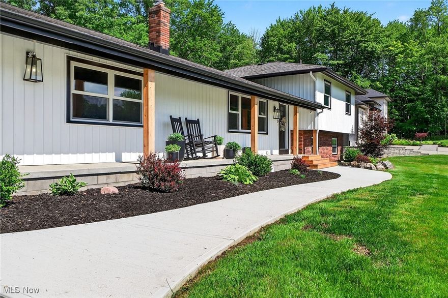 Rare Opportunity in Solon! Fully renovated inside and out, this stunning home is nestled on a private 3-acre lot that backs directly to the Solon Woods State Nature Preserve—offering unmatched privacy, scenic views, and access to peaceful nature trails.Located in the award-winning Solon School District, it’s the perfect blend of modern updates and serene surroundings.The open-concept main floor features a custom kitchen with quartz countertops, custom cabinetry, and a high-end gas range. A large center island and stainless steel appliances make it ideal for both daily living and entertaining. The natural light is enhanced by under-cabinet lighting, recessed fixtures, and tasteful accent lighting—allowing you to set the perfect tone for any occasion. New flooring throughout, refinished hardwood upstairs, and two fully remodeled bathrooms featuring a beautifully tiled walk-in shower, tiled tub/shower combo, updated vanities, and modern fixtures. Major mechanical upgrades include a newer furnace and A/C, updated electric panel, and a new hot water tank (2024)—ensuring energy-efficient comfort for years to come. Exterior upgrades include siding, gutters, and trim, Andersen windows and doors, rebuilt chimney, new concrete parking pad with drain,and a professionally regraded yard to ensure proper drainage. Outdoor living spaces are just as impressive with a covered front porch, stamped concrete patio, and a massive screened-in patio with new roof and screening—ideal for relaxing or entertaining. A large outbuilding offers versatile space for storage, hobbies, or a workshop.This property also benefits from full city services, including public water and sewer, free seasonal dumpster service, and free woodchip delivery—a rare perk for a wooded, private lot. Don’t miss this unique opportunity to enjoy modern comfort, natural beauty, and top-rated schools in one of Ohio’s most desirable communities. Call your favorite Realtor today to schedule your private tour!