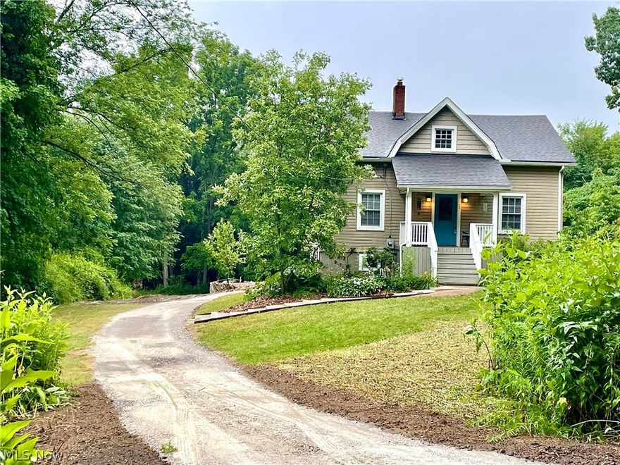 If you are looking for a cozy cottage retreat, this is it! 2+ gorgeous acres with rolling topography. This home has been lovingly cared for and has updates like vinyl siding, vinyl replacement windows & Brand New Vinyl plank flooring on first floor, along with freshly painted 1st floor in fashion neutral colors, There are a total of 4 garage spaces, (2 tandem attached) and "free standing" 2 car detached garage. This property is located a very very private street with only 4 other homes, yet it is minutes to much of the best shopping in Green, plus it is minutes to the Portage Lakes! There is a valuable gas allowance of 100 MCF annually for a substantial savings on heating bills! This allowance has covered current owners for 11 months out of the year. House has 200 amp service with 220 volt in detached garage plumbed for welder and compressor. There is a Air induction water treatment system that removes sulfur and iron without salt or chemicals, New dishwasher and microwave in 2020, Wat