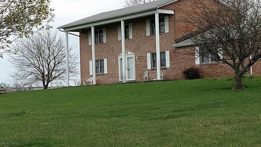So serene as you pull in the long driveway approaching this beautiful 2 story brick colonial home with front porch pillars. Situated on 5 acres just outside of Pataskala. The interior provides lots of space with 4 bedroom 2.5 baths a formal living/dining room - family room off the kitchen with a fireplace - and enjoy the back 4 season sun room. Plenty of space for livestock with a 6 horse stall barn and an additional 2 stall detached - 2 car detached garage - a small creek for water supply. This one owner home is ready to be updated with the new owners - (note: the neighbor has additional vacant land for sale)
