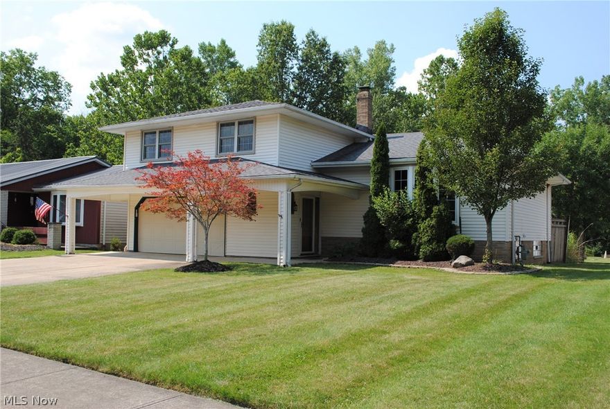 Wonderful 4 bedroom Split level home is totally updated and certain to impress.  Open floor plans compliments today's living.  All natural hardwood floors have been refinished throughout.  Living and dining rooms open to recently remodeled kitchen with large center island, granite counters, newer backsplash and stainless steel appliances.  4 generously sized bedrooms with good closet space.  Remodeled full bath offers double sink vanity made from Onyx stone, walk in shower, tub and beautiful ceramic tile.  Spacious family room.  Basement offers recreation room and laundry.  Backyard includes large covered porch area leading to the paver patio... perfect place to enjoy the outdoors.  2 story outbuilding provides plenty of storage.  Deep yard backs up to creek and woods providing a beautiful setting year round.  Newer roof, furnace and central air.  Updated windows.  Sprinkler system in front yard.  Great location minutes to I-71.  Call agent today.