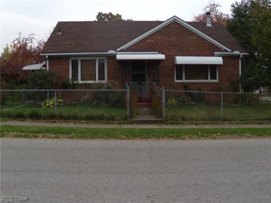 Very clean all brick ranch with 2 bedrooms 1 bath on 2 parcel lot. Living room with wood burning stove. Large eat in kitchen with appliances. Beautiful hardwood floors and wood window blinds throughout. Large attic with stairway is waiting to be finished for additional living space. Large full basement with washer and dryer and toilet. Oversized 2 car garage with electric. Private fully fenced in yard. Newer roof. Great starter home or investment.