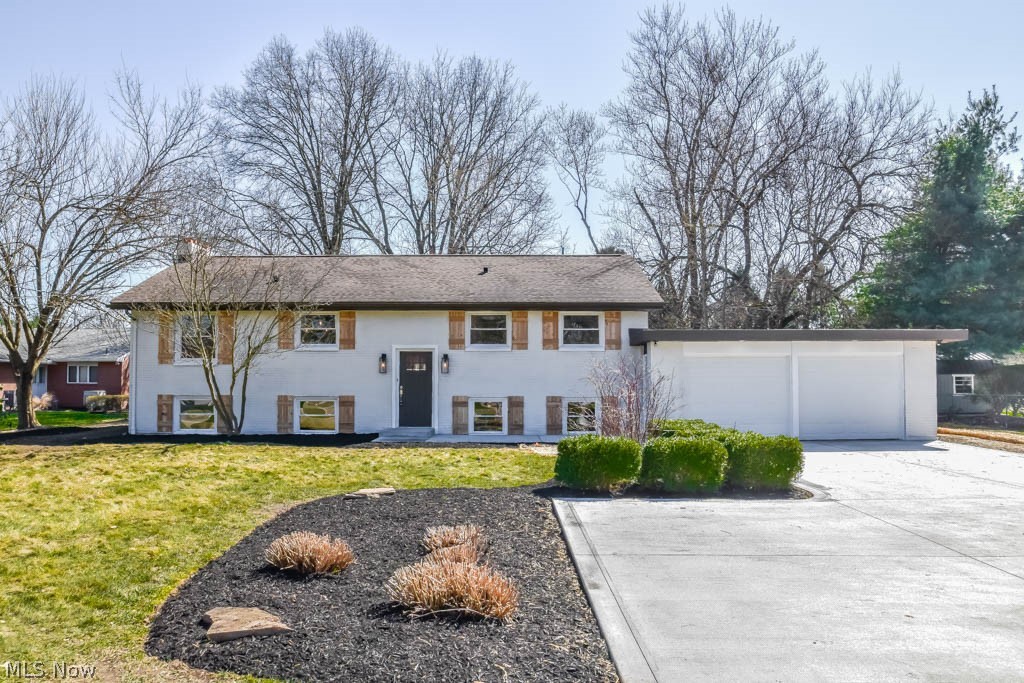 Gorgeous 4 bedroom, 3 full bath home in North Canton schools! Completely remodeled with new flooring, fresh paint, new front concrete, furnace, A/C, hot water tank and windows - this home is the true definition of move-in ready! Find your culinary inspiration in the brand new kitchen with granite countertops, white cabinets, subway tile backsplash, breakfast bar and stainless steel appliances! Adjacent dining room opens to the living room with a lovely fireplace. Down the hall, the master suite offers 2 closets and a private full bath with a walk-in tiled shower and new vanity set against a shiplap wall. Bedroom 2 is on the main level along with a full bath featuring tile shower surround. Great setup for an office or kid’s bedroom! As you head downstairs, sliding doors open to a beautiful, surprising sunroom at the back of the house with slanted windows along the back wall and vaulted ceilings. Access to the fully fenced backyard featuring a gorgeous patio with a pergola, a storage she