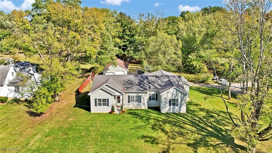 Why settle for ordinary when you can have a 2021-built home on over an acre in Norton that’s equal parts comfort, play, and peace of mind? This 3-bedroom, 2-bath beauty has a layout that just works—wide-open living space for hanging out, a kitchen that begs for big breakfasts and late-night snacks, and a primary suite that feels like your own little hideaway, with an ensuite including a walk-in shower and walk-in closet. All the rooms, including the laundry room and kitchen are handicap accessible with extra-wide doorways! There is also a HUGE, unfinished basement, plumbed for another full bath, just waiting for your finishing touches! But the real fun is outside. Not only is there an attached 2-car garage, but there is also a detached garage that is 35’ x 23’, with 3 garage doors, one of which is extra tall! It has been used as a workshop/extra storage for years and is a dream space whether you need room for cars, tools, hobbies, or the project you’ve always wanted to start. It’s not just a garage—it’s possibility under one big roof. Over an acre of land means there’s room for frisbee tosses, garden dreams, or the biggest bonfire your friends have ever seen. And location? That’s the cherry on top. Less than half a mile to the Norton Community Center for basketball, tennis, soccer, or the playground and community events. Grab groceries or eat lunch at the Norton Shopping Plaza and rest easy knowing the fire station is just .3 miles away. Easy access to I76 or SR21, and very close to both Norton High School (.7 mi) and Norton Primary (.3 mi).

This isn’t just a place to live—it’s a place to play, create, recharge, and make everyday life a little more fun. Come, check it out for yourself and schedule your private showing today!