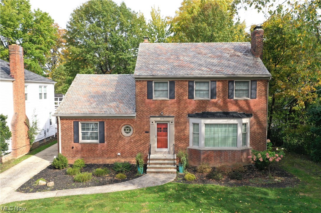 4113 Washington Blvd, University Heights, Ohio 44118 is a stunning home WITH location, location, location in the beautiful & highly sought community of University Heights, kindly known as the city of beautiful homes! Great close proximity to John Carroll University as well as beautiful local parks & eateries, coffee shops & outstanding world-renowned medical facilities! This home features 4 spacious bedrooms plus a bonus room (currently utilized as a yoga room but could serve as a 5th bedroom or guest suite or family room if desired) w/ 4 bathrooms, 2 full & 2 half baths. Recently finished hardwood floors & great natural sunlight highlights this gorgeous home w/ rear deck & 2nd floor balcony, rear entry 2 car garage! Brick Colonial w/ charm, gorgeous trim & freshness of updated beautiful Tuscan feel kitchen, granite countertops, travertine backsplash, gorgeous lighting, great layout, & bistro coffee breakfast room. Awesome Dining Room w/built in cabinetry & French doors to sunroom leading to rear deck, huge Living Room w/ fireplace flanked by windows & gorgeous front bow picture window & arched openings, again with natural stunning hardwood; half bath is conveniently located between entry & 1st floor bedroom, currently utilized as an awesome study office. Up to the 2nd floor, stop at the Bonus Room & the beautiful hardwood continues into 3 main bedrooms w/ both full bath & half bath en suite! Don't forget finished basement w/ another en suite & Family Room w/ 2nd fireplace!