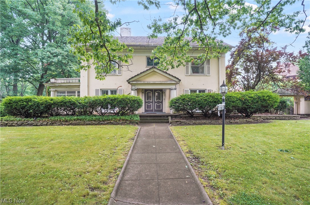 Endless possibilities! Use your imagination with this five bedroom, three full and two half baths colonial home. Front yard overlooks Cultural Gardens. WOW! Come into the foyer to the living room and family room which share a fireplace, large dining room with hardwood floor, and kitchen. Sunroom. The charming eat in kitchen has abundance of cabinets. Half bath on first floor. Upstairs you can find three bedrooms, and one and half bathrooms. Master suite has 2 closets, sitting room with fireplace and a full bathroom. The third level has two bedrooms, possibly three and one full bathroom. Wall to wall spaciousness! Lower level has a wet bar, half bath and laundry area. The gorgeous outside offers a courtyard, and a guest house that is connected to the two-car attached garage. Furnace (6 years old). View of the park. Minutes from hospitals. Own with pride!