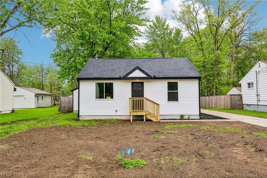 Completely renovated ranch in Willoughby, OH, offering one-floor living on nearly a half-acre lot with a new feel throughout! Thoughtfully redesigned with an open-concept layout, vaulted ceilings, and a private primary suite, this home delivers both style and function. This home has been fully rehabbed with exceptional craftsmanship and attention to detail. Nearly everything is new, including flooring throughout, a beautifully updated kitchen with new cabinets and appliances, electrical, plumbing, insulation, windows, doors, gutters, and a new AC unit. The expanded floor plan includes a spacious primary suite with an ensuite bath, plus a convenient side entry mudroom. A brand-new garage and concrete driveway add to the home's curb appeal and functionality. Located in desirable Willoughby, this move-in ready home offers easy freeway access and modern updates with timeless quality. If you're searching for a fully renovated ranch in Northeast Ohio, this is it.