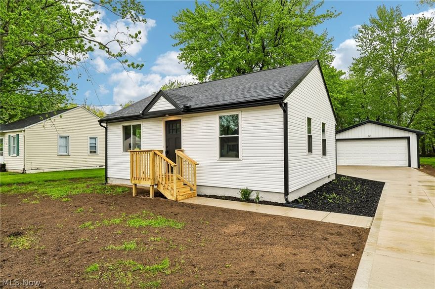Completely renovated ranch in Willoughby, OH, offering one-floor living on nearly a half-acre lot with a new feel throughout! Thoughtfully redesigned with an open-concept layout, vaulted ceilings, and a private primary suite, this home delivers both style and function. This home has been fully rehabbed with exceptional craftsmanship and attention to detail. Nearly everything is new, including flooring throughout, a beautifully updated kitchen with new cabinets and appliances, electrical, plumbing, insulation, windows, doors, gutters, and a new AC unit. The expanded floor plan includes a spacious primary suite with an ensuite bath, plus a convenient side entry mudroom. A brand-new garage and concrete driveway add to the home's curb appeal and functionality. Located in desirable Willoughby, this move-in ready home offers easy freeway access and modern updates with timeless quality. If you're searching for a fully renovated ranch in Northeast Ohio, this is it.
