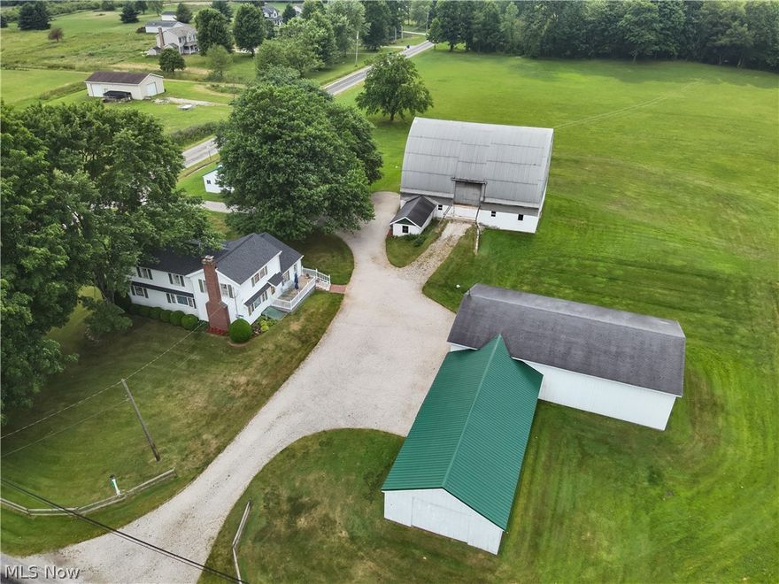 Century home sitting on 15 Acres in Portage County! Built in 1901, this well maintained Conventional style home offers 2122 square feet of living space, featuring three bedrooms, two full baths, an eat in kitchen, living room with wood burning fireplace, formal dining room, 9x14 sunroom, 11x13 first floor laundry room and a 10x22 wood deck. Exterior features include 32x56 Shop with electric, water, heat available and concrete floors, a 24x48 garage, 11x15 Milk house, 40x60 Bank Barn, 14x20 Granary and a 16x20 Sugar House. Situated in Shalersville Township within Crestwood Local School District, this property has so much to offer. Schedule your private showing before this one is gone!