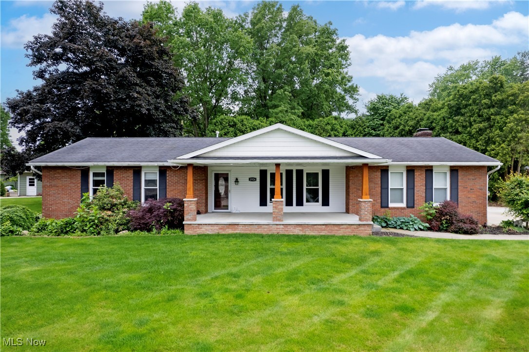 Nestled on almost a 1/2 acre in a desirable location, this charming 3 Br, 2 Ba all brick home won't last long!! Enjoy sipping lemonade while relaxing on the 24 x 12 covered front porch with a view of the lake or roasting marshmallows around the fire pit in the secluded back yard. The heart of the home is the kitchen, boasting an abundance of oak cabinets, tile backsplash, granite counters, stainless appliances, and spacious eating area. The family room features a cozy gas fireplace and laminate flooring while the living room has brand new carpet. The master bedroom features a double closet and full bath with tiled shower. Completing the first floor are 2 additional bedrooms, and full bath with granite counters and tiled shower. Laundry hook-ups on the first floor and in the basement. 16 x 16 patio