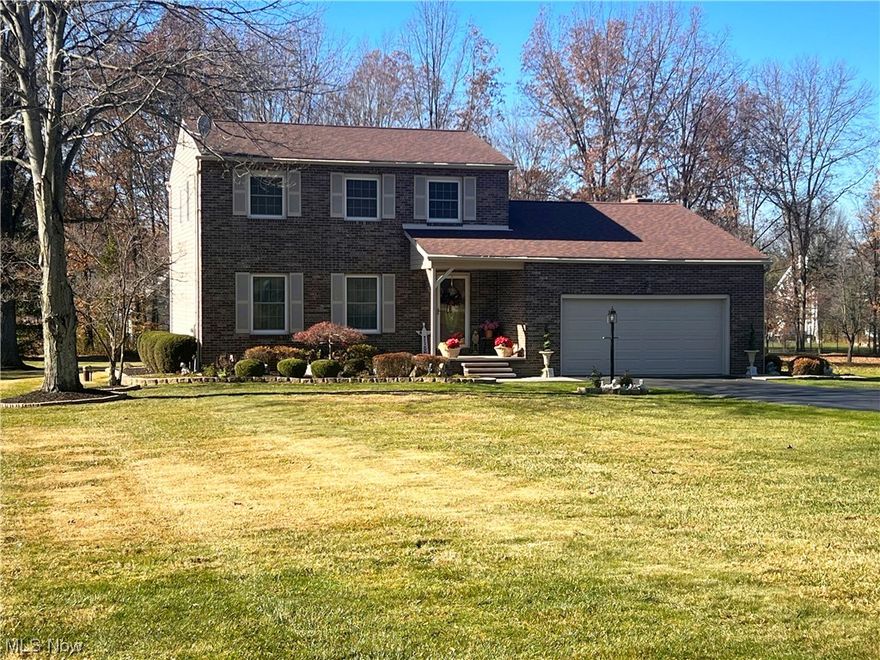 This stunning brick and vinyl-sided home is sure to WOW from the very second you pull into the driveway. At first glance, you will notice the very large and beautifully landscaped yard as the home is perfectly situated on a corner lot. Step into the foyer and make your way into the well-lit living room with beautiful windows overlooking the glorious front yard landscape. As you walk towards the dining room, you will immediately set your eyes on the fabulous and newly remodeled kitchen. The kitchen boasts white soft-close cabinets, granite countertops surrounded by glass backsplash with under-cabinet lighting, stainless steel appliances, and a bar area for guests to gather around. Right off the kitchen, you will find a remodeled full bathroom with a walk-in shower. Step down to the expansive family room with tall ceilings and the stunning full-length brick and gas fireplace. This room is the perfect space for entertaining guests, especially with access to the large composite deck that overlooks the sprawling backyard oasis. Upstairs you will find 3 generously sized bedrooms, including the master bedroom and a well-situated full bathroom. In the finished basement you will find a laundry room with a very large crawlspace area. Freshly painted oversized 2 car garage. This well-kept Howland home is sure to please with so many new features and upgrades.  Ask for a list of upgrades. Don't wait to make this beautiful house your perfect home!