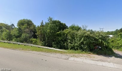 Prime Industrial Property in Sheffield Village. 2.76 Acres near I-90, Ohio Turnpike & Major Manufacturing. Existing home on property.
