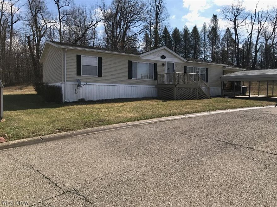 Very nice double wide on rented lot (190/mo.) , 2000 model, 1400 sq. ft., 26 X 53, 3br, 2 bath, master bath has 2 sinks with separate tub and shower; large eat in kitchen with lots of cabinets, 10 X 12 storage building, 10 X 20 deck, 2 car carport.  Potential buyer must fill out an application and be approved by park. Appliances to stay include range (gas), frig., microwave, washer, dryer.  Security system is disconnected.