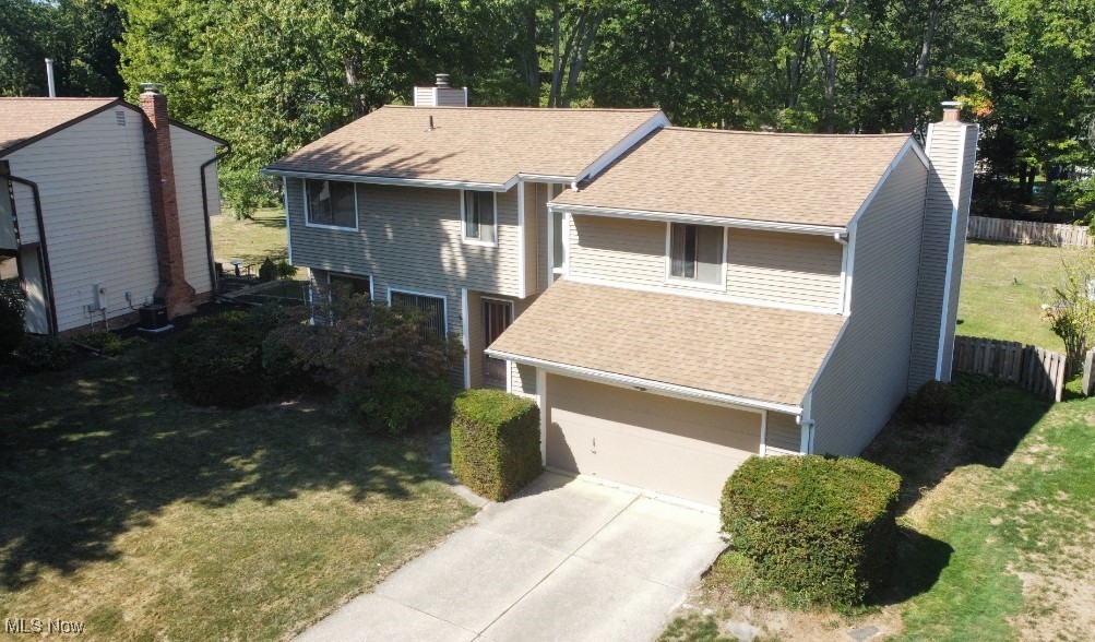 This spacious 2700 sq ft colonial offers great space and solid bones. This home features 2 fireplaces, 1 in the Vaulted Great Rm and 1 in the Family Rm. Eat- In- Kitchen w appliances. Dining Rm. The vaulted Great Rm is spacious and has slider to rear covered porch. Family Rm offers wet bar and built in bookcases next to fireplace. 4 spacious bedrooms up with Loft that offers endless opportunities for use. Ensuite offers bath and another full bath up for the other bedrooms. 1st floor laundry room. Basement offers plenty of storage space. 2 car attached garage. Rear covered porch and deck. Fenced backyard. This home awaits your updates!!!