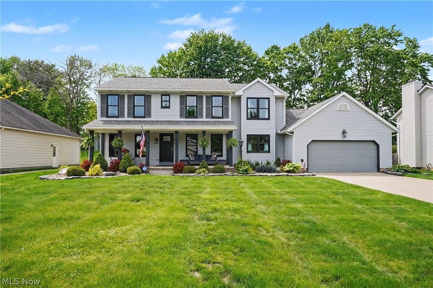 Welcome to this beautifully maintained home in the desirable Mount Vernon Estates community. From the moment you arrive, you’ll appreciate the attention to detail.  Charming covered front porch featuring both seating and dining areas, perfect place to relax or entertain. Impressive foyer with stunning oak flooring throughout the main level. The foyer is flanked by a formal dining room w/tray ceiling and office/den with elegant glass door, offering both privacy & sound reduction. The heart of the home is the spacious great room, showcasing vaulted ceilings, vent-free gas fireplace & skylights filling the space w/natural light. The open loft overlooks the great room. The oak kitchen offers an abundance of cabinetry & counter space, along w/under-cabinet lighting, pull-out drawers, & recently updated Stainless steel appliances. The 1st floor laundry room includes a built-in bench w/storage & utility sink. A recently updated powder room completes the main level. Upstairs, the primary suite features a charming window seat w/storage, a custom walk-in closet, & recently renovated en-suite bath complete w/jetted soaking tub & skylight. Two additional generously sized bedrooms each feature their own private bathrooms. The 11-course lower level is unfinished but already plumbed for a 4th bathroom, offering endless possibilities. The seller leaving pool table as a gift. The attached 2-car garage includes hot & cold water access & scuttle attic storage. Outside, the beautifully landscaped backyard features a deck, tranquil koi pond w/waterfall & a storage shed for gardening tools. Additional updates and features include: New black-framed windows installed '20, glass block windows '26 furnace & A/C '24, 50-gallon hot water tank, Roof approximately 10 years old and 200-amp electrical service. Conveniently located off Norton Avenue near Cleveland-Massillon Road, this home offers easy access to I-77, shopping, restaurants, and local attractions including Grandpa’s Cheese Barn.