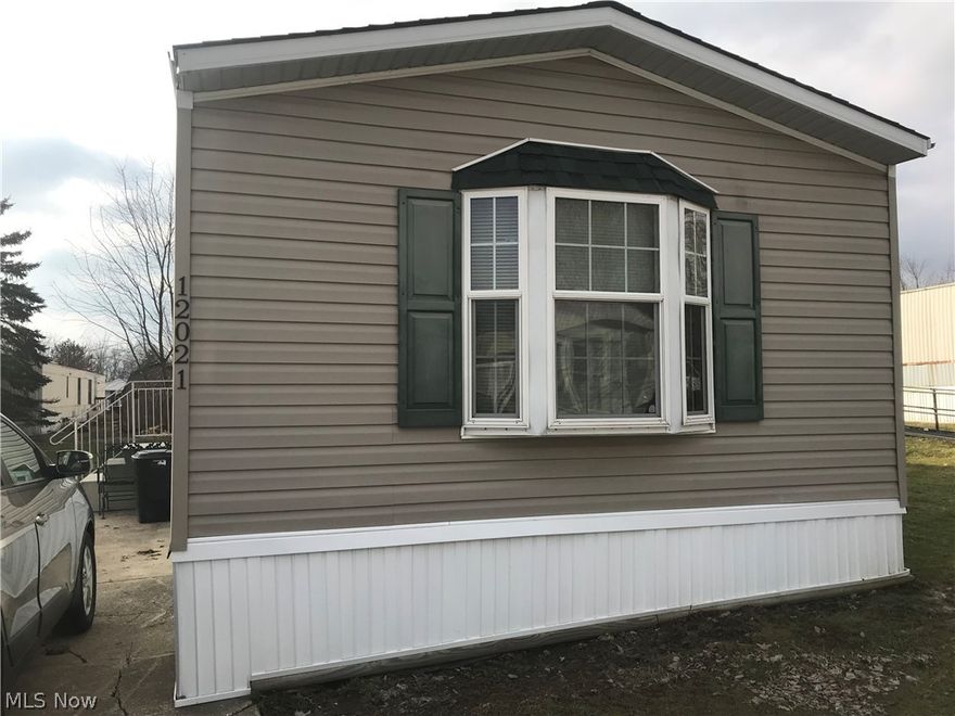 Easy Carefree Living in this 2010 mobile home featuring a very pleasing floor plan.  Master Suite is on one end and offers a glamour bath with tub and stand up shower.  Nicely appointed kitchen includes the appliances and is open to the Living Room. Two more bedrooms and a full bath for guests or family.  Prime Corner lot gives lots of space and room for play or relaxation.  Very Convenient Location in Leaders Mobile Home Park is just minutes from Chardon Square.  The Park offers a Clubhouse and Picnic Pavillon. Clubhouse hosts different activities for residents through out the year.  Bike Path runs right behind the Park and minutes from Claridon Woodlands Park with Lodge, fishing lake, rock climbing, rope course high in the trees for the daring and hiking/bike trails.  Check this out for Very Affordable Low Maintenance Lifestyle.