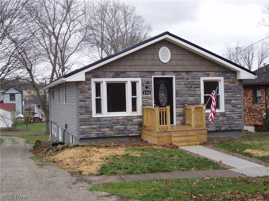 This remodeled home is like walking into a new home and has a second lot to the left of the home as you face the front. On the exterior there is a new metal roof, siding,windows, doors, deck, sidewalk, and patio. Inside has new electric, plumbing, drywall, doors, trim, kitchen cabinets, stainless steel appliances, floor covering, and a stone electric fireplace. The half bath is in the basement which keeps the people when they are outside from tracking through your house. The basement has lots of room for storage and additional living space. This like new house is cheaper than rent and allows the buyer to experience the American dream of home ownership.