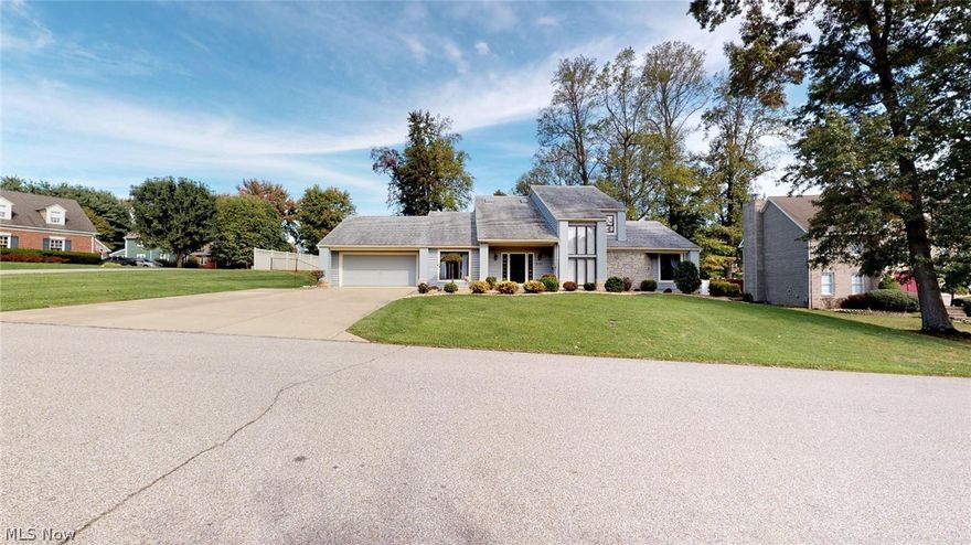 Wonderful contemporary style home with open floor plan, vaulted ceilings and 2 story stone fireplace. Inviting Cherry kitchen with ample lighting and an abundance of storage and Cherry hardwood flooring, 1st floor master with covered deck perfect for relaxing! Fabulous back deck! This home has been freshly painted throughout and the sellers have purchased new carpeting that will be installed soon to replace all of the carpeting.