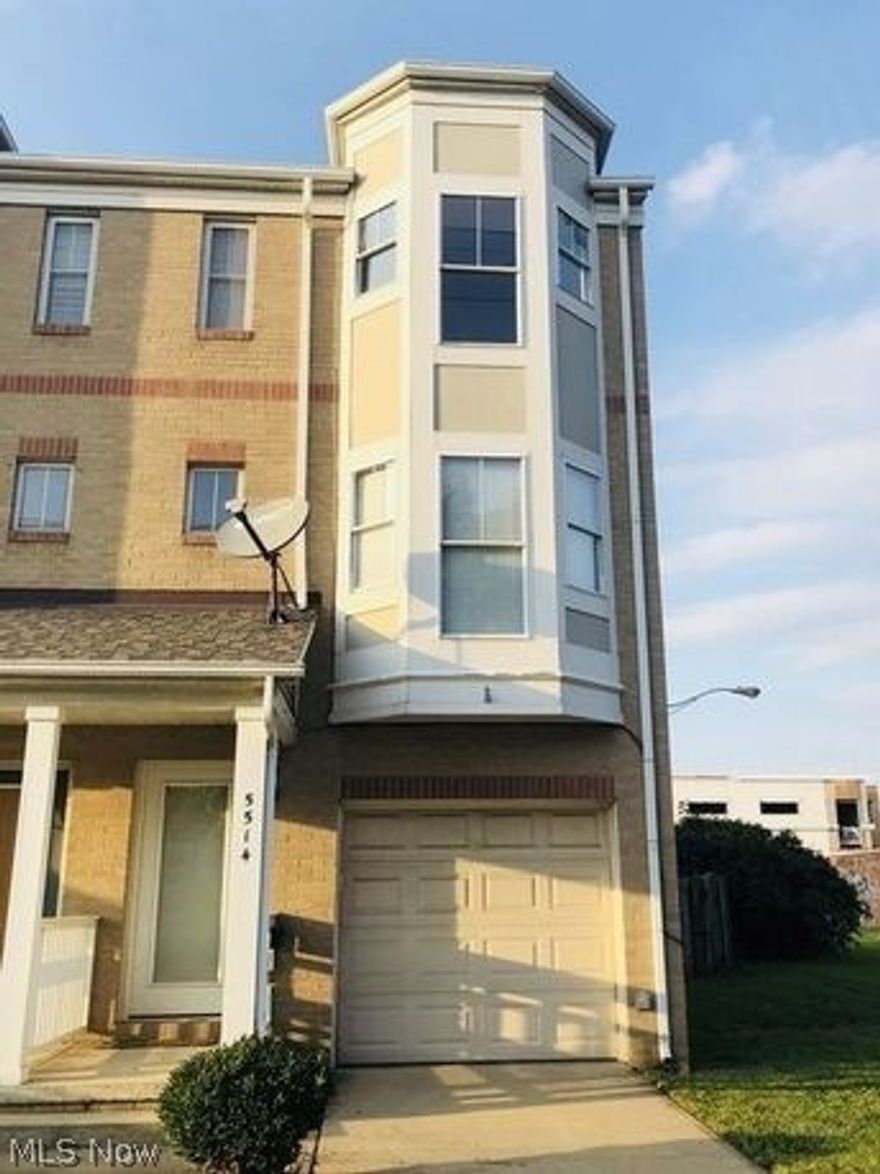 RARE opportunity to own an end unit townhouse in the popular Bridge Square neighborhood of the Detroit Shoreway, one of Cleveland's hottest areas! This townhouse boasts abundant natural light, vaulted ceilings, gas fireplace, hardwood floors and carpet on first and third floors. Recent updates include neutral paint throughout and carpet. Enjoy three floors of living space, with large master bedroom and closet, plus third-floor laundry closet with newer washer and dryer. Attached garage and ample storage space. Fenced-in back yard with newly planted grass that is ready for your personal touch!