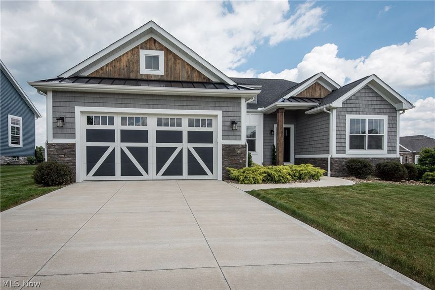 Picture perfect describes this beautiful ranch style home offering all of the conveniences of one floor living. You’ll find superior craftsmanship & attention to detail throughout. The foyer entry leads to a very open floor plan featuring a formal dining room, great room with 13’ coffered lighted ceiling, gas fireplace with stone hearth & barn beam mantel, beautiful kitchen with stainless steel appliances, office with cathedral ceiling & decorative wainscoting, & laundry room with utility sink & built in cabinets. The split bedroom design includes master suite with tray ceiling, charming master bath with clawfoot tub & separate shower, & two other bedrooms separated by a full bath.  The finished lower level provides approximately 1,100 square feet of living space with nearly 9’ ceiling, a large rec room, bar, 4th bedroom & full bath. A delightful covered porch with ceiling fan overlooks the stamped concrete patio & lovely, fenced yard with irrigation system. Other amenities of this bea