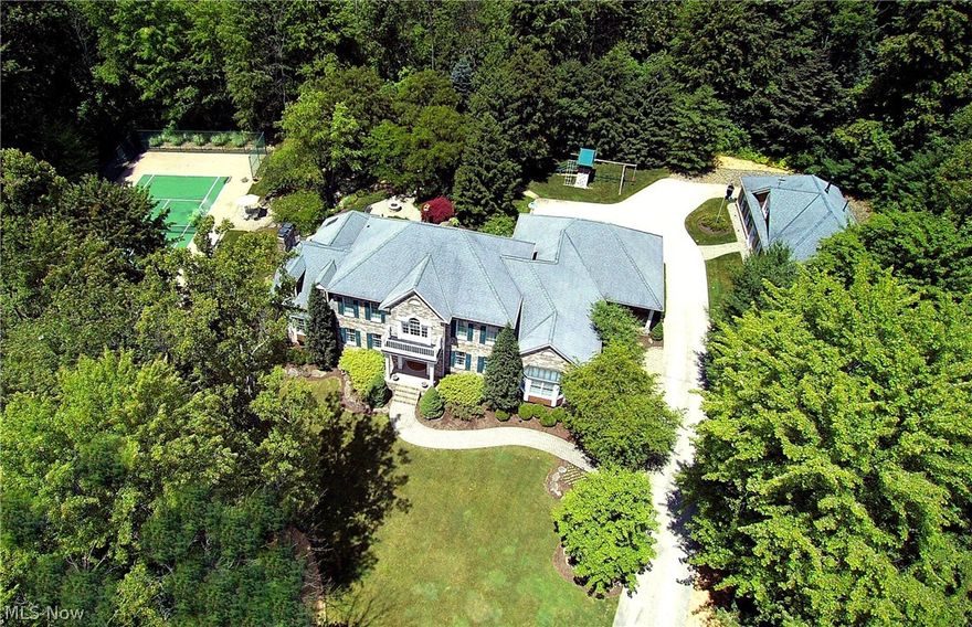 Hudson Schools...Own a piece of paradise in The Ledges! The tree lined drive leads to an exquisite brick manor situated on one of the loveliest pieces of property in the area! This elegant home offers a fabulous floor plan designed to take advantage of the gorgeous views. A brand new kitchen designed and completed by Studio 76 includes all new cabinets, Typhoon Bordeaux granite countertops, Wolf Range with 6 gas burners, Miele dishwasher, Sub-Zero refrigerator, Sub-Zero refrigeration drawers, GE Profile Double convection ovens, GE Profile microwave, and so much more! The house and property are absolutely perfect for entertaining! Enjoy peace and tranquility on more than 3 acres of meticulously maintained and beautifully designed landscaping including a tranquil waterfall and meandering stream, ponds, multiple paver patios on varying elevations and a custom made gazebo in the woods! A splendid selection of well- groomed mature plantings offers maximum privacy. Enjoy a game of tennis any