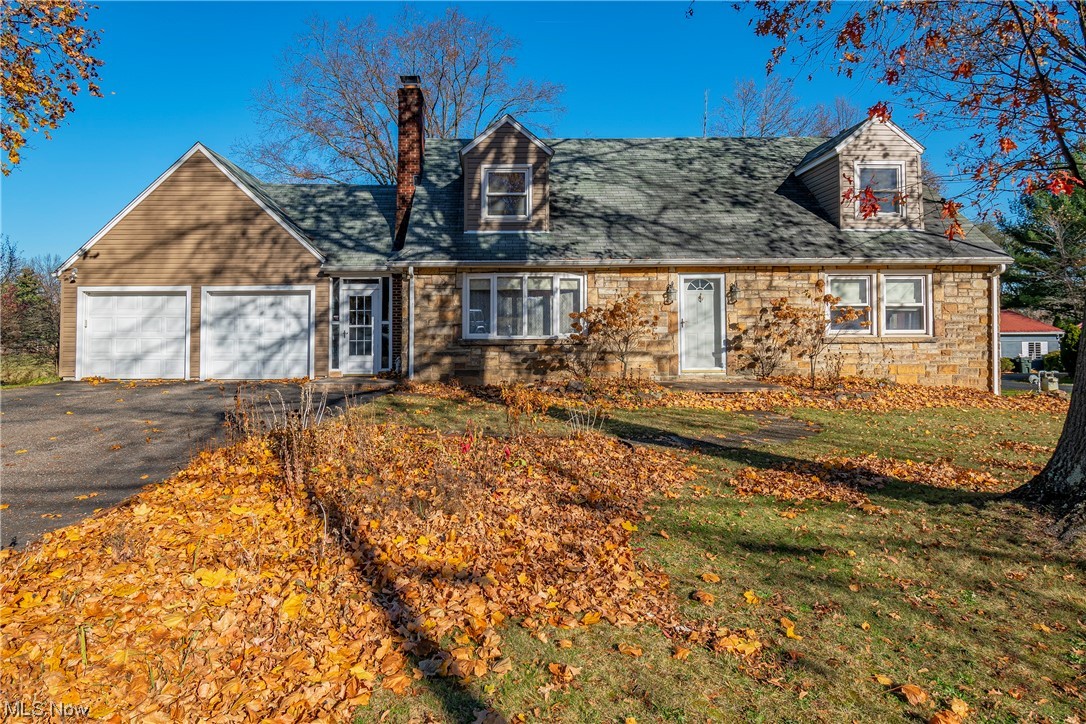 Welcome home to this beautiful 4 bed, 2.5 bath home sitting on nearly an acre lot! The spacious deck overlooking the oversized background is perfect for entertaining guests or enjoying your morning coffee. The breezeway connecting the 2 car garage with the home doubles as a mud room and gives access to the newly stained deck. Natural light abounds on the main level, featuring large windows. This home offers a living room with a cozy gas fireplace, dining room, and kitchen boasting stainless steel appliances and new backsplash. There are four great sized bedrooms, one conveniently located on the main level along with an additional space used as an office or fifth bedroom. The remaining two bedrooms and a full bathroom are located on the upper level. A spacious walk-in closet is ready for your finishing touches. It doesn't stop there! Venture downstairs to the in-law suite with family room and kitchen. Just down the hall is a half bathroom and the fourth bedroom. Lower level walks out to the patio and fenced-in backyard. Notable updates include: new siding 2021, main level paint 2021. Don't miss your opportunity to own this amazing property! Schedule your private tour today!