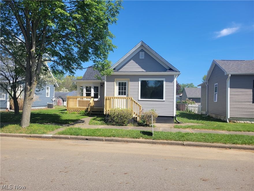 This is a very cozy completely remodeled home on a nice quite street. Home has a large family room with an open archway to kitchen and dining area. Two bedrooms, laundry area, and full bath on main floor.  This home has been completely remodeled with many new features.  Some of the new features include roof, siding, new kitchen, complete new bath, flooring, doors,paint, new furnace and a couple new windows. Outside features a fenced in back yard for your pets and a single car garage on back end of lot accessible from alley.and a smaller storage barn for your mower and garden tools .