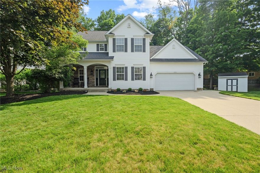 Welcome to this beautifully updated Colonial in the welcoming Stow Woods neighborhood! From the moment you arrive, you’ll notice the impressive curb appeal, highlighted by refreshed landscaping and a newly painted front door. Step inside to a bright, open foyer that leads into the main level featuring brand-new laminate flooring and fresh, neutral interior paint that creates a clean, modern feel throughout. The kitchen seamlessly connects to the dining area and living room, offering an ideal open layout for everyday living and entertaining. Convenient first-floor laundry and an oversized two-car garage add functionality to this level. Upstairs, you'll find four generously sized bedrooms—including one flexible space that could easily serve as a home office, playroom, or second living area. The primary bathroom has a private master bathroom and his and her closets. The fully finished basement is a standout, recently completed with new drywall, new carpeting, and crisp paint, providing even more space to relax or entertain. Enjoy scenic walking trails nearby, sidewalks, and a local coffee shop less than a mile away. With other shopping and restaurants just minutes away, this home offers the perfect blend of comfort, style, and convenience. The AC and Furnace have been replaced in 2018 and the hot water tank in 2015 for peace of mind.