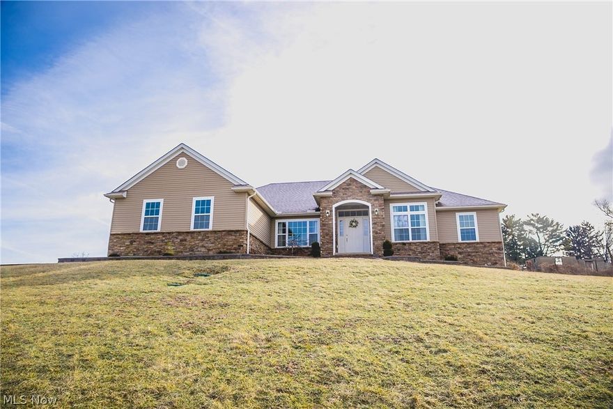 Exceptional 3 bed 2 bath house situated on picturesque 5 acres of ground with great views. Open concept living space features stone fireplace, vaulted ceiling, and new engineered hardwood floors. Over-sized master suite features large bedroom, walk-in closet, and master bath featuring a soaking tub. Partial basement features a wide open space, along with bar, and possible craft room.