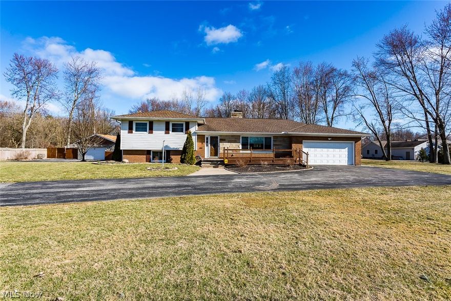 Welcome home to this beautiful and well maintained family home in Olmsted Township. This 3 bedroom, 2.5 bath is surrounded by a beautiful wooden area creating a park like feel. You are welcomed by an ample sized foyer that leads you into the perfect space for a home office. Step over into the spacious living room with new plush carpet, great lighting, and a stone mantle fireplace to relax by in the evenings. Make your way into the dream kitchen with many new updates. This eat-in kitchen features unique styled flooring, granite counter tops, and a riveting back-splash. The kitchen cabinets and island provide vast amounts of storage space throughout the kitchen and eating area. A second fire place available to keep you warm while you are dining. Stainless steel appliances are included.  First floor also includes a separate space for laundry and a full bath. Move up to second floor with the master suite and two additional bedrooms. The second floor features a shared bathroom and newer win