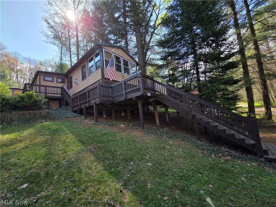 If you've been patiently waiting for a superb lake cottage to call your own, your day has come at beautiful Leesville Lake! The living room plays host to a majestic stone-flanked fireplace in true lodge style. Kitchen features stainless steel appliances, a breakfast bar, and Corian counters. The adjacent dining area is spacious and includes a wood-burning stove and lots of natural light. Tongue-in-groove ceilings and floors throughout make for a truly authentic cabin vibe. Newer stainless front laundry appliances will be conveyed with the home. Take in the picturesque views of nature from the wraparound deck, or the frontal breezeway. Additional storage room under the deck. Metal roof on both the home as well as the 20'x20' insulated storage/workshop building, which was built in 2012. There's also a second "she-shed," perhaps for gardening supplies, yard toys, or the like. Whether full- or part time, your lake life opportunity is beckoning now! Ask your favorite agent to see this property today and don’t forget to ask about the pontoon boat that could go with the property!