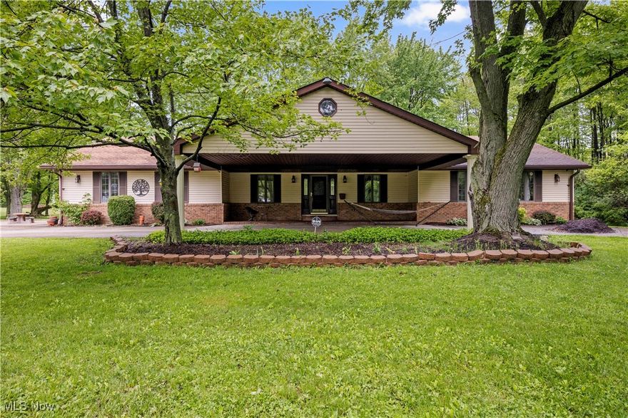 Welcome home to this wonderful 5 bed/3 full bath, 3900 sq.ft. custom-built RANCH on 7 ACRES. Home is set back 800 feet for the ultimate in privacy and seclusion. Completing this amazing property is a 2100 sq.ft. barn with updates: wood burning stove; insulated walls/partially insulated ceiling; off-grid solar system with potential to export power to home; new breaker box/lighting. The interior updates include a remodeled primary bath  with an addition of a walk-in shower area; updated 2nd bath; wallpaper removal and repainted; finished garage with new drywall; paint; updated ceiling lights/wall outlets, and more! Step into the inviting family room, where natural light pours in through wall of windows and sky lights. This private homestead oasis offers a rare opportunity to live sustainably and independently with small farm capabilities; solar power, rainwater catchment system; offering the freedom and infrastructure to thrive. Don't miss out on this gem!