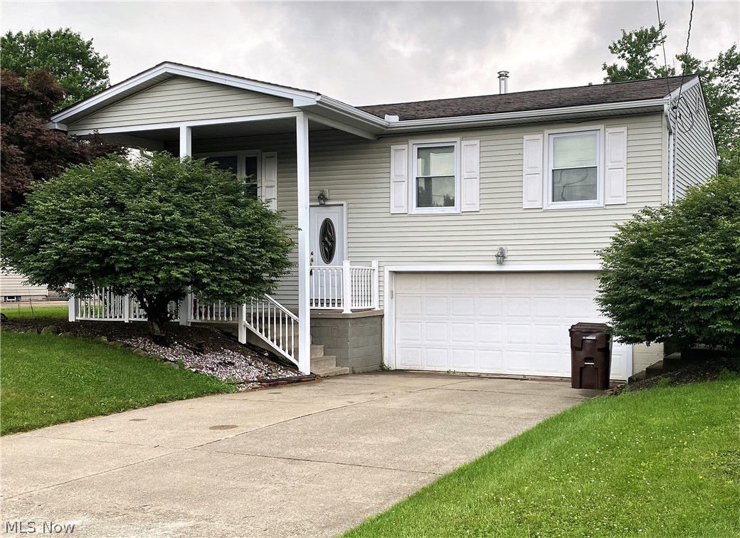 Plenty of room in this three bedroom Bilevel in Austintown. Covered Porch is perfect for enjoying summer days along with a deck off the dining room. Kitchen with plenty of cabinets, Newer laminate floors in the living room - dining room combo. There are two full baths, laundry room and a nice size recreational room downstairs that is perfect for entertaining. One of the bathrooms also has an entry right from the two car garage! A must see!