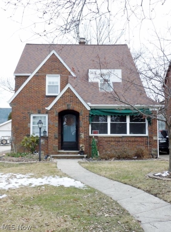 Spectacular 4 bedroom, 2 bath Brick Colonial situated in the desirable Edgecliff Beach Club area of Euclid! It's spacious throughout with beautiful hardwood flooring on both the first and second floors. The generous size living room has a gas fireplace and walks out onto the enclosed front porch that provides additional living space to enjoy peace and quiet in all weather. The Formal dining room leads to the eat in kitchen with another back door that leads to the fully fenced in yard with additional patio space and two car garage. The second floor has generous sized bedrooms with lots of storage space. And, The finished third floor fourth bedroom is stunning complete with skylights giving an unobstructed view for starry nights. Plus, there's an additional entertainment area on the lower level with a full bathroom. It's a well cared for home with lots charm and character. The location is within walking distance to the Lake Erie Edgecliff Beach Club, fine dining and shopping. Close freew