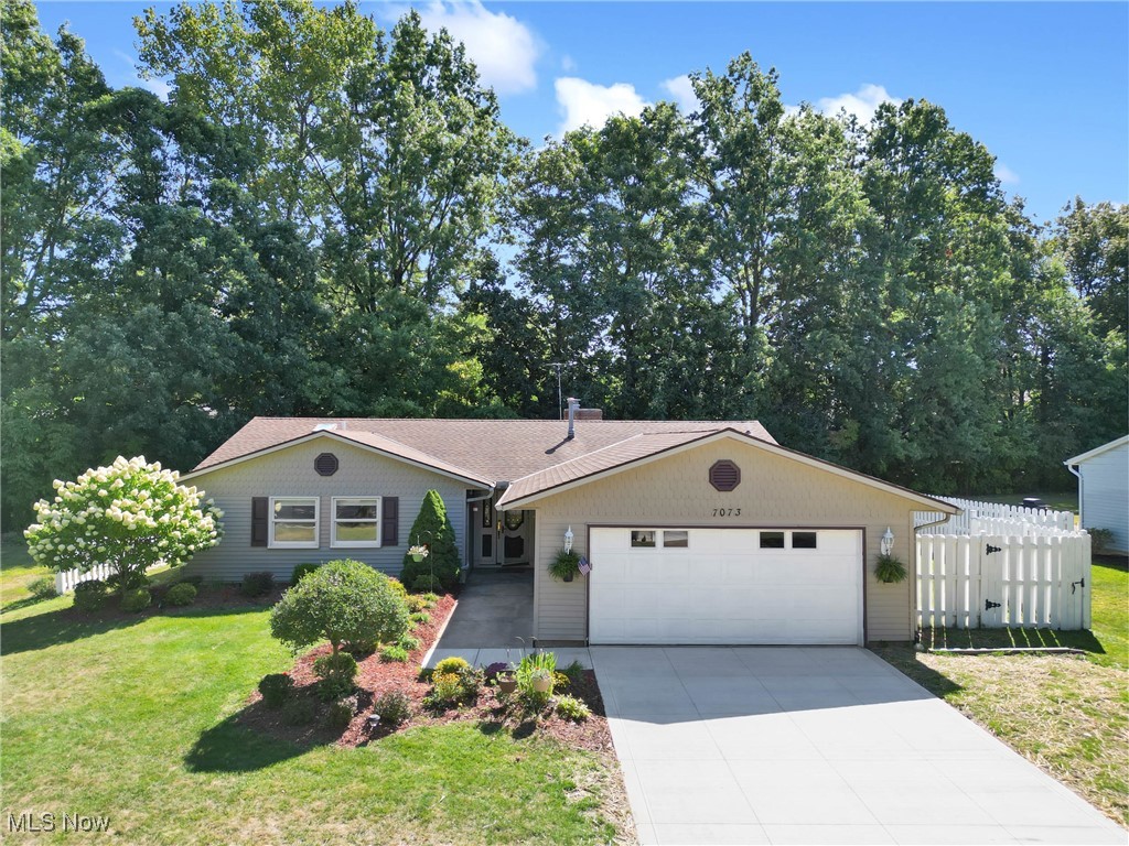 Welcome to this beautifully maintained 3 bedroom, 2 full bath ranch in the sought-after Wayside Lakes community of Mentor, offering one-floor living at its finest. Step inside to a spacious and inviting entryway that opens into a large living and dining area, perfect for entertaining guests, relaxing by the fireplace, or enjoying family meals. The open layout flows seamlessly into the kitchen and first-floor laundry for everyday convenience. One of the highlights of this home is the expansive sunroom with screened/glass windows, ideal as a playroom, additional living space, mudroom, or a quiet retreat. From here, you'll have easy access to both the backyard and the fenced side yard. This home features 3 generously sized bedrooms and 2 full bathrooms, providing plenty of comfort and functionality. Conveniently located near shops, restaurants, entertainment and more. Recent updates include a new driveway (2025), Pergo laminate flooring in the living room, dining room and all three bedrooms (2025), vinyl plank flooring in the kitchen (2023), and a new furnace and A/C (2022). Truly move-in ready, this ranch offers the perfect blend of charm, updates, and convenience. Don't miss your chance to call this one home, schedule your showing today!
