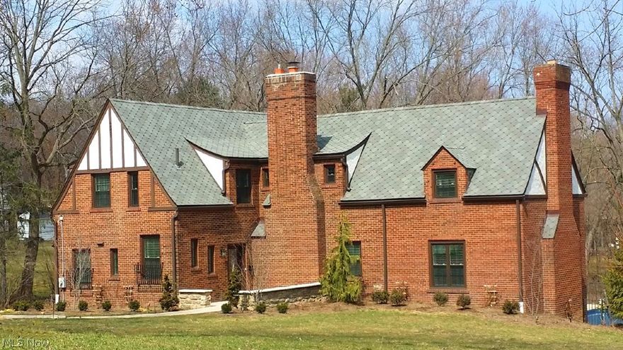 This beautifully updated Tudor sits majestically on over an acre of land. The open floor plan Kitchen includes granite counter tops & Island, stainless steel appliances & wainscoted cabinetry. The formal dining room/sun room feels bright and airy with its many windows and serene views. A stunning white marble fireplace is a focal point of the Great Room, along with bay windows that overlook the spectacular in-ground pool & fountain. The library/theater room has gorgeous woodwork, built-ins, fireplace & granite wet bar w/refrigerated draft beer system.  The 1st fl laundry/mud room & half bath complete the first level. On the second level, the Master Suite features double sinks, frame less glass door tiled shower, spa tub, private water closet & two walk-in closets. Three spacious secondary bedrooms have abundant closet space as well. Great care has been taken during renovations to retain many of the original design elements of this amazing home! See brochure for detailed updates!