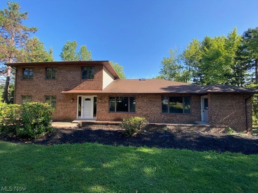 Take a look at this brick home with over 3,000 square feet of living space.  The home offers updated kitchen cabinets with granite counter, newer floor coverings throughout, updated light fixtures and updated bathrooms.  The home has a detached 4 car garage, rear deck and includes both parcels of land over 3 acres.  The interior has been nicely painted and generous room sizes.  A large foyer entry and walk in storage area on second level.  Make an effort to see this home!
