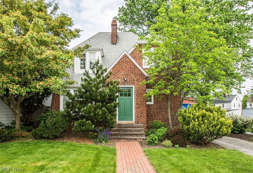 This striking brick English Colonial is a must see! The charm and warmth of yesteryear resonates throughout! Off the entry vestibule through French glass doors you'll find the spacious living room with an attractive brick, deco fireplace flanked by custom leaded glass cabinet! Custom corner display cabinets compliment the formal dining room nicely! The redesigned kitchen features quality cherry cabinets, lots of counter space and appliances are included! French doors open to a cozy sun room leading to an expansive covered deck and nicely landscaped yard! Upstairs you will discover two generous bedrooms including a large owners' bedroom with a computer area and an expanded bath with retro claw tub and walk-in shower! Basement B-Dry system with transferable warranty! All this and situated on prime West Park street ideally located between Kamm's Corners and Warren Village!