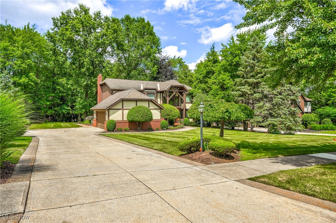 Discover refined living in one of Brecksville's most coveted neighborhoods. This 3200 sq. ft home, plus 1550 sq. ft. finished lower is privately situated on a beautifully landscaped 102 x 210 lot and it offers a true masterpiece of elegance, craftsmanship, & timeless design. This home features 4/5 bedrooms & 3.5 baths, 2 fireplaces & so much more. The bedroom on the main level is currently being used as an office, but with two closets and built-ins, it could easily serve as a guest room or first floor bedroom. The heart of the home is a fabulous gourmet kitchen with newer Schrock Cabinets, neutral granite counters, stone back splash, high end appliances, beverage refrigerator and an extra sink. The open-concept layout flows seamlessly into a spacious great room featuring a beautiful gas fireplace and direct access to a level, private, park like yard, and an expansive deck with
stamped concrete walkway. Formal living and dining rooms add a classic touch, perfect for hosting guests or enjoying quiet family gatherings. Upstairs, you'll find 4 generously sized bedrooms, including a serene primary suite that offers a true retreat, double entrance doors with a huge walk-in California type closet and a spa-like shower complete with a deep Jacuzzi tub. The finished lower level is designed for versatility and entertainment, featuring a second kitchen, a full bathroom, billiard room and fireplace. It could easily serve as an in-law suite or teen suite, making the possibilities endless. With thoughtful updates over the years including the roof, windows, patio doors, HVAC, and more, this home has been well-maintained. The property features timeless architecture, luxurious amenities, & it is located just minutes from Brecksville's city pool(s), tennis and pickle ball courts, gym and more. Metro Parks, National Park, and ski resorts are just minutes away! Easy commute to either Cleveland or Akron. Schedule your private tour today & make this remarkable home yours.