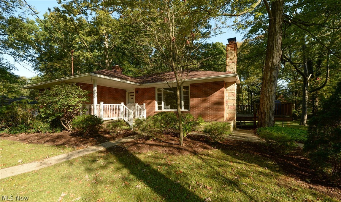 Absolutely INCREDIBLE property! Tucked back in on a dead end street, this beautiful brick ranch sits on just over a half acre of private wooded land. This home has a finished walk-out basement, one car attached garage, huge secondary 2 car garage, extra wide wrap around cement drive & RV/boat pad! The big garage has it's own electrical with outlets for the RV. There is even a line tied into the septic to empty out your RV. The massive yard is surrounded by stunning mature trees, ivy & Pachysandra around the house. Enjoy the view from the front porch or large deck over looking the property. Wait, there's still an amazing house! Large living room opens into the dining room & kitchen, with durable solid hardwood floors & all new paint. The kitchen has a new backsplash, countertops, sink & disposal & comes with the gas range, refrigerator & microwave. The 1st floor also has 3 bedrooms & a full bathroom with new flooring. Downstairs a large & bright finished family room with a ha