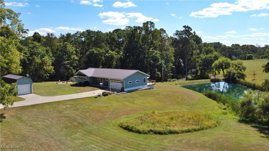 FRESH UPDATES AND READY FOR IMMEDIATE POSSESSION - Welcome to your private retreat!  Nestled on 3.45 beautifully landscaped acres, this meticulously maintained ranch-style home offers the perfect blend of comfort, functionality, and tranquility.  Boasting 3 spacious bedrooms and 2 full baths, this open floor plan is designed for both everyday living and effortless entertaining.

Enjoy peaceful mornings overlooking your fully stocked fishing pond, surrounded by pristine landscaping and the gentle sounds of nature. The home features numerous upgrades, including a durable metal roof, a modern functional kitchen with plenty of storage features and newer appliances, built in basement shelves, and new commercial-grade gutters, providing long-lasting protection and peace of mind, along with the convenience of county water and natural gas.

Whether you're into fishing off your back porch, a nature lover, or simply craving a quiet escape, this property delivers. The expansive grounds offer space for a vibrant garden, outdoor gatherings, or simply relaxing under the stars.

Additional features include an attached 2-car garage large enough for a full size truck and SUV, and a detached 1-car garage/shed—perfect for hobbies, storage, or a workshop.  All this, set in a peaceful, quiet location that feels miles away from the hustle and bustle, yet still conveniently located.

Don’t miss this rare opportunity to own a slice of serenity - schedule your private showing today!