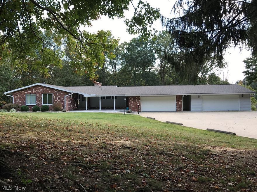 Exceptional brick ranch on 11 acres, newer kitchen with hickory cabinets, corian countertops and top of the line stainless steel appliances. Newer furnace, AC, windows, oak flooring. Expansive deck across back of home. 4 car garage. Belpre schools