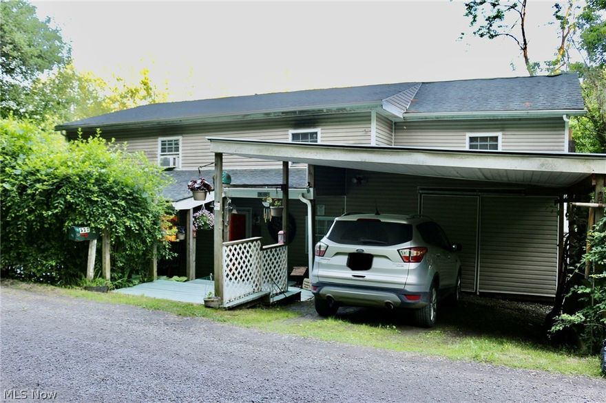 If you're looking for serene and quiet, then this property is for you!  You'll enjoy many mornings/evenings on the spacious wrap around deck overlooking the beautiful flowing Buffalo Creek and watching lots of wildlife!  This home is nestled in a cozy spot; protected from the road with tons of healthy foliage.  The loft master bedroom overlooks the family room as well as a huge picturesque window.  It boasts an oversize walk in closet as well.  The laundry area has abundant storage with a 2nd full bath!  The impressive living room has lots of natural light and then there's a bonus family room to boot!  All new flooring is attractive laminate with the addition of the bathrooms being waterproofed.  You'll never run out of storage space in this home...there's a walk in pantry too! New electric.  Has never flooded.  New metal roof put on 9/2022.  Call me today for your private tour.  It's a must see!