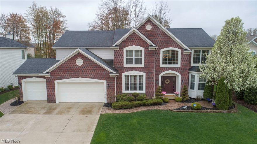 Stately brick front Colonial nestled in Waterford Crossing. This amazing home is just shy of 6,000 sq.ft of finished living space that includes 5 bedrooms, 4 full and 1 half baths & large finished basement. Stunning 2 story foyer w/ staircase, catwalk & wrought iron spindles. Arched entries open to the formal den w/ bay window & delightful dining room. Gleaming hardwood floors flow from the foyer into the impressive great room w/ soaring ceilings, walls of windows and floor-to-ceiling fireplace. Gourmet eat-in kitchen is complete with a center island, granite counters, crisp white cabinetry, stainless appliances, beautiful backsplash & breakfast bar in the bright vaulted sunroom w/ built-in shelving. Guest/in-law suite w/ private full bath, walk-in closet & private access to the patio. The gracious stairway leads to 4 more sizable bedrooms, 2 full bathrooms and convenient laundry room. The massive master suite showcases a huge walk-in closet, sitting area & glamour bath w/ double vanit