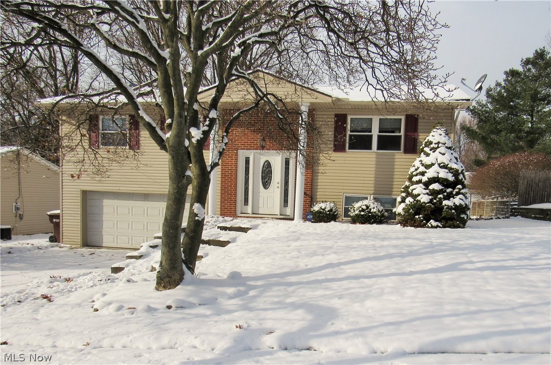 Welcome home to this lovely split-level! 3 bedrooms, 1.5 baths, 2 car attached garage, and a fully finished basement. This house has a few updates with modern touches through out. The open floor plan provides the perfect setting for entertaining and a large, fenced-in back yard with a patio to host those summer barbecues. Updates include a new furnace equipped with an LED touch screen panel, a new fence in the back of the yard, and epoxy flooring in the basement. Roof is only 6 years old and the house comes with a security system and all appliances. You do not want to miss this house!