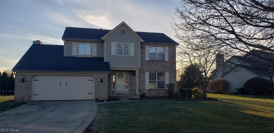 Move in ready 4 bedroom 2.5 bath 2story -walking distance to neighborhood pond newer roof - newer kitchen renovation with stainless steel appliances gas stove all white cabinets - drop in sink - large lr/dr an additional 15x17 family room with so much natural sunlight a decorative fireplace laminate wood floors throughout -sliding doors to custom patio - large level lot First floor laundry off 2 car garage - much desired 4 bedroom - primary suite with renovated bathroom to include soak tub - walk in shower - ceramic tile floor -full block basement plumbed for bathroom new hot water heater