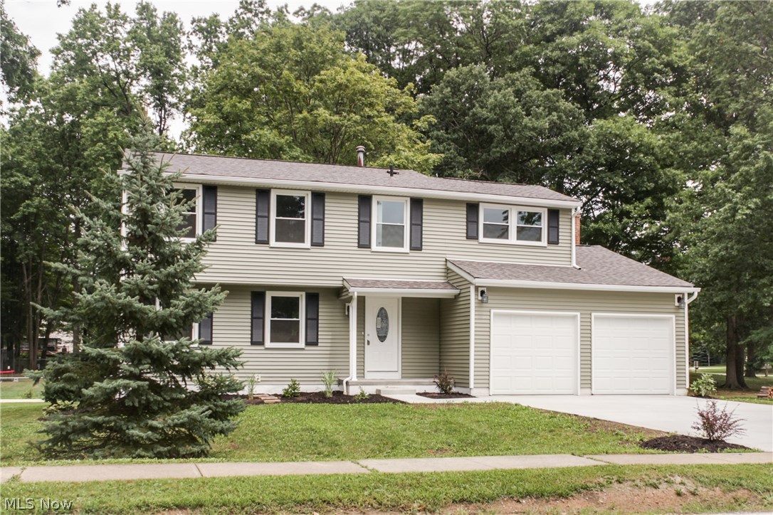 Amazing totally renovated four bedroom colonial with 2.5 bathrooms, large kitchen/eating area, formal dining room, huge living room and a large family room with wood burning fireplace which opens to a new deck overlooking a private backyard. This house has a new roof, new energy-efficient windows, new siding, new gutters and downspouts, new front door and new sliding door. The kitchen is a chefs dream, completely new with high end cabinets, granite countertops, under mounted sink and brushed nickel faucet. It has a beautiful stainless steel range, microwave, dishwasher, and a two door stainless steel refrigerator with ice and water dispensers. The wood floor flows very nicely into the formal dining room. There is a totally renovated half-bath on the first floor. On the second floor you will find four totally renovated bedrooms with large closets. The master bath in Main bath were also updated. In addition, all interior doors have been replaced along with new lighting & new carpet. The